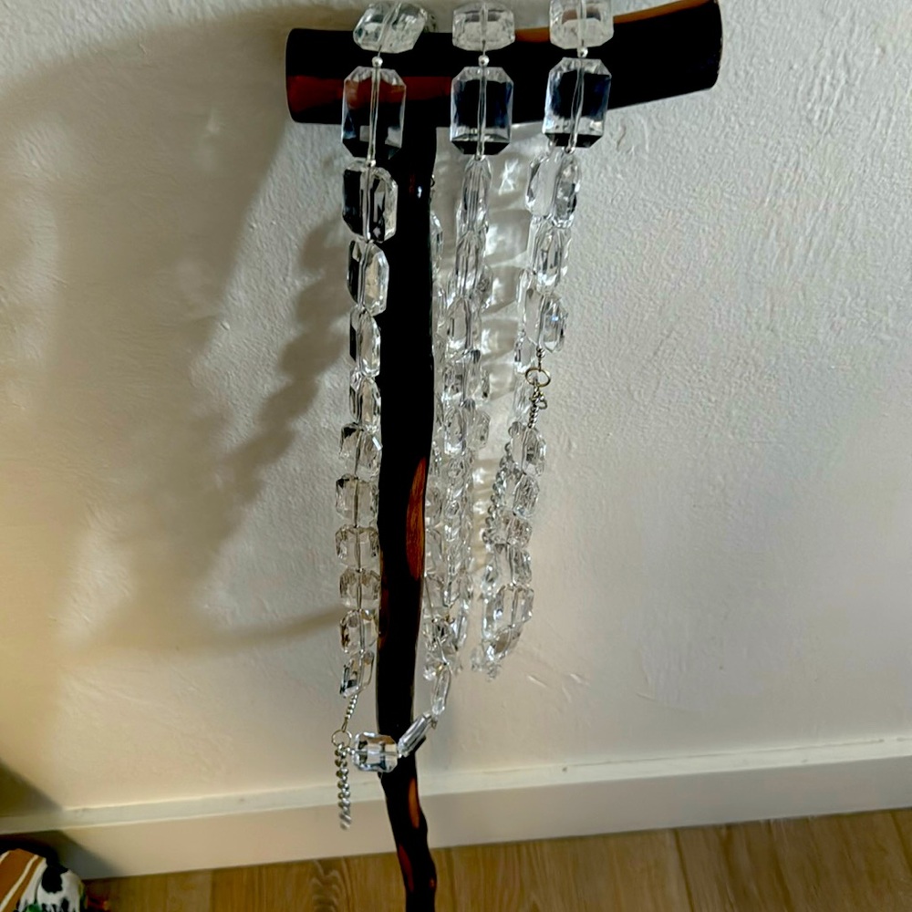3 clear plastic necklaces.